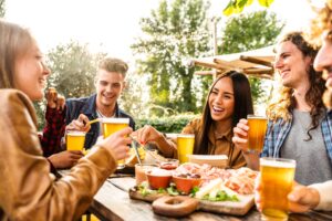 People drinking beers and eating food